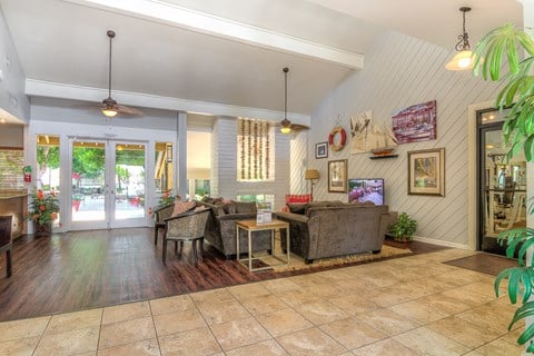 the living room of a house with a couch and a table